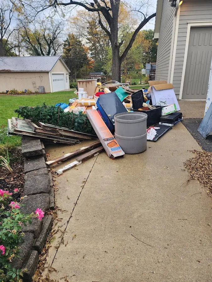 Dumpster being loaded with debris for Commercial Dumpster Rental in Landen